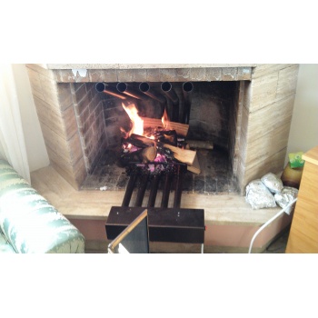 Air exchanger for fireplace air heater