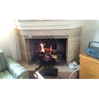 Air exchanger for fireplace air heater